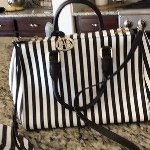 Brand new never used Henri Bendel Signature Stripe bag with bonus pouch